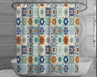 May include: A shower curtain with a patchwork design featuring geometric patterns in shades of blue, orange, and teal on a cream background. The curtain hangs in front of a white bathtub, creating a decorative bathroom element.