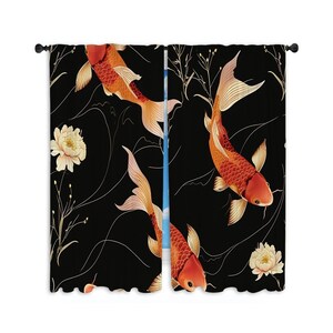 May include: A pair of black curtains with a repeating pattern of orange koi fish and white flowers on a black background.