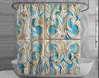 May include: A shower curtain featuring a repeating pattern of ornate, raised floral and scrollwork designs. The design is in shades of blue, cream, and tan, creating a vintage or antique aesthetic. The curtain hangs in front of a white bathtub.