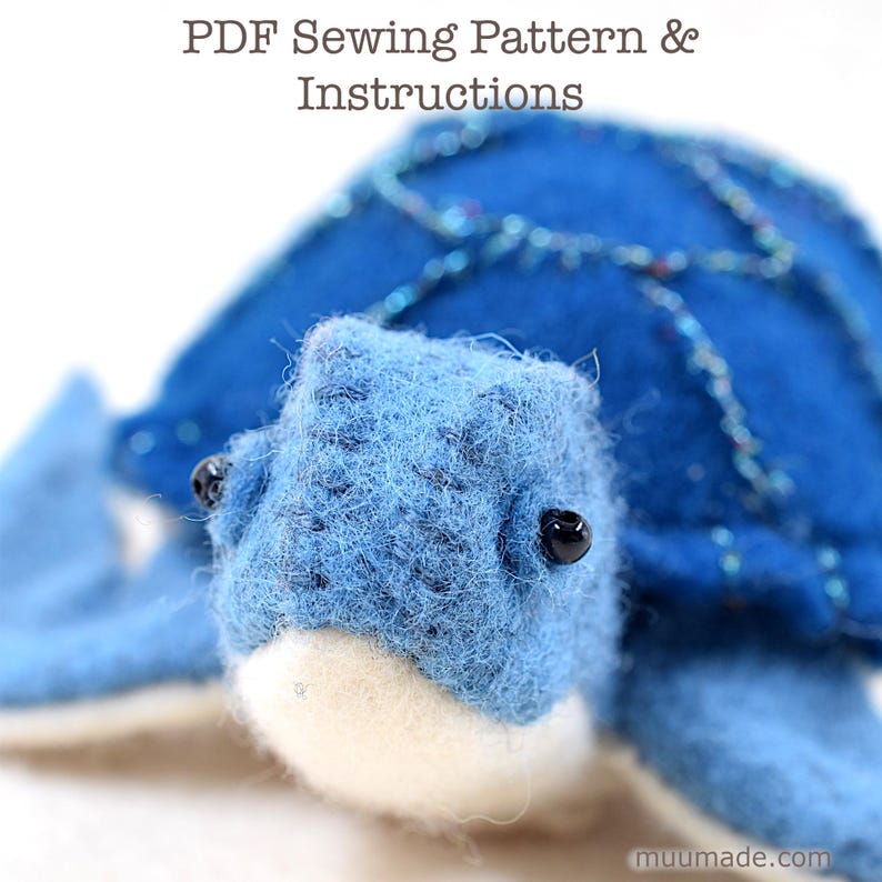 A blue felt sea turtle's close up view. Its sewing pattern & instructions is available for instant download from muumade.etsy.com.
