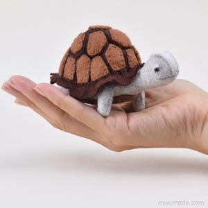 A brown felt turtle. Its sewing pattern & instructions is available for instant download from muumade.etsy.com.