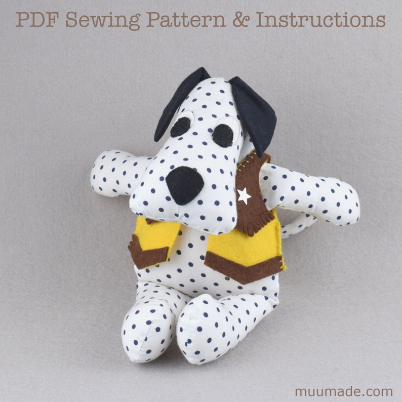 A soft fabric dog with a cowboy vest on. It's a Dalmatian, sitting up right with its forelegs spread open as if about to hug someone! Its sewing pattern & instructions are available for instant download.