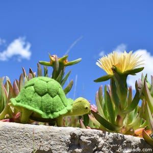 A green felt turtle. Its sewing pattern & instructions is available for instant download from muumade.etsy.com.