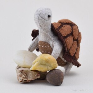 A brown felt turtle. Its sewing pattern & instructions is available for instant download from muumade.etsy.com.