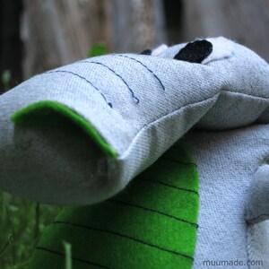 A soft fabric T-rex dinosaur plushie. Its sewing pattern & instructions set is available for instant download from muumade.etsy.com.