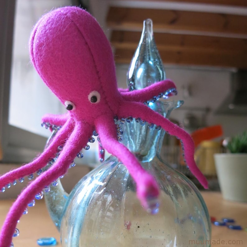 A felt octopus. Its sewing pattern & instructions are available for instant download from Muumade.etsy.com..