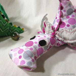 A soft fabric dragon plushie. Its sewing pattern & instructions set is available for instant download from muumade.etsy.com.