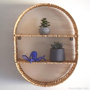 A felt octopus. Its sewing pattern & instructions are available for instant download from Muumade.etsy.com.