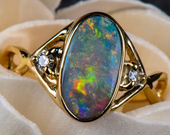 Australian Opal 9ct Gold and Diamond Ring. Size 7.75US