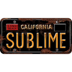 May include: A rusty black license plate with the text "CALIFORNIA" and "SUBlime" in yellow letters. The plate also has a red rectangle with the text "LONG BEACH" in white letters.