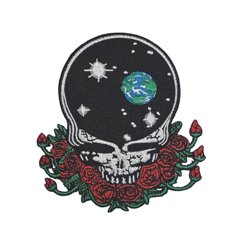 May include: Embroidered patch featuring a skull with a starry night sky design and a small Earth. The skull is surrounded by red roses with green leaves. The patch is black, white, red, green, and blue.