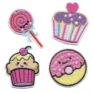 May include: Four embroidered iron-on patches featuring a pink lollipop, a purple cupcake with a pink heart, a yellow cupcake with a pink cherry, and a pink donut with white sprinkles.