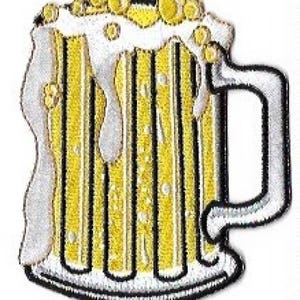 May include: An embroidered patch depicting a beer mug with foam and bubbles on top, in white and yellow.