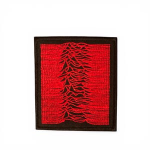 May include: A square patch with a black border and a red embroidered design. The design features a series of red, wavy lines against a black background. The patch is likely for clothing or accessories.