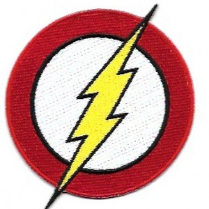 May include: A circular patch with a yellow lightning bolt on a white background, framed by a black outline and a red border. The lightning bolt is angled across the centre of the patch.