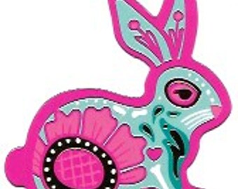 May include: A decorative, stylized bunny in bright pink, teal, and black. The bunny features a large flower design on its side and intricate patterns. The design has a Day of the Dead aesthetic.