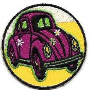 May include: A purple Volkswagen Beetle with white flowers and green accents on a yellow background. The car is a popular symbol of the 1960s.