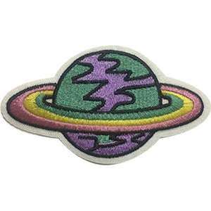 May include: An embroidered iron-on patch of a green and purple planet with a pink, yellow, and green ring around it.