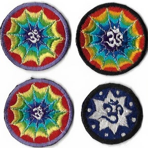 May include: Four round embroidered patches with a rainbow mandala design and the Om symbol in the center. The patches are in different colors: red, blue, black, and white.