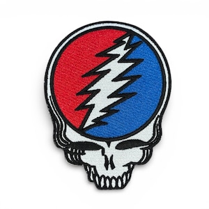 May include: Embroidered patch featuring the Steal Your Face skull logo. The design includes a red and blue circle bisected by a white lightning bolt. The skull is white with black outlines and details.