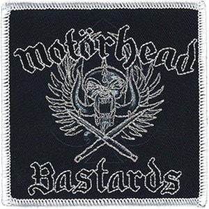 May include: Black and white embroidered patch featuring the text "Motörhead Bastards" and a skull with wings and crossed sticks.