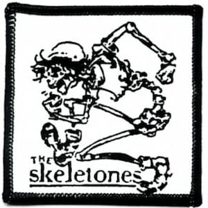 May include: Black and white patch with a skeleton illustration and the text "The Skeltones".