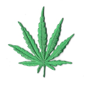 May include: A vivid green embroidered cannabis leaf. The patch is intricately stitched, displaying the leaf's veins and jagged edges. The design is set against a white backdrop, emphasizing the bright green hue.