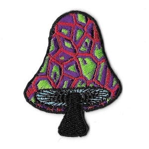 May include: An embroidered patch of a psychedelic mushroom with a green, purple, and red patterned cap and a black stem.