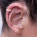 see more listings in the 14k Gold Helix Earrings section