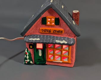 Vintage keramiek oplichtend kerstdorp drogisterij roze vakantiehuis 110 V
