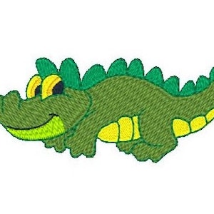 Puede incluir: Un cocodrilo verde de dibujos animados con ojos amarillos y vientre amarillo. El cocodrilo sonr&iacute;e y tiene una espalda con estampado verde y amarillo.