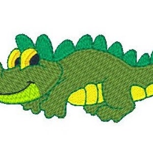 Puede incluir: Un cocodrilo verde de dibujos animados con ojos amarillos y vientre amarillo. El cocodrilo sonr&iacute;e y tiene una espalda verde con p&uacute;as.
