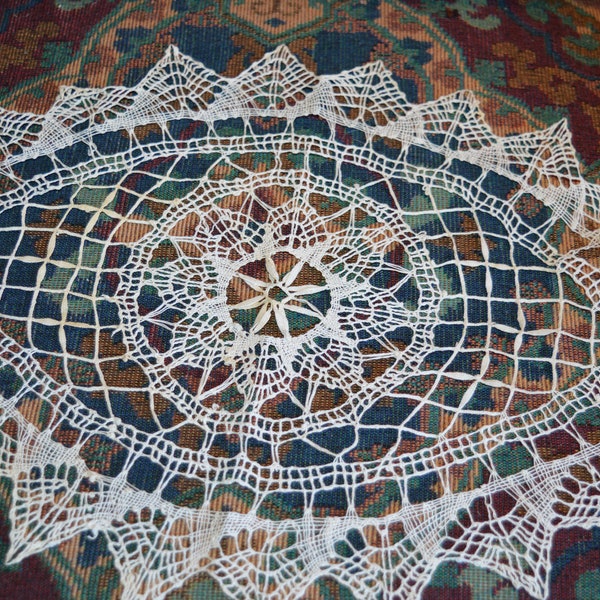 Oval doily / fine design / 16" x 11" / good condition / delicate