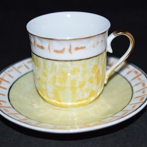 Decorative / yellow / tea cup / gold trim / Not for food use / Cup 2&quot; / Saucer 4.25&quot; / Excellent condition / yellow / small tea cup