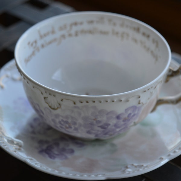 Teacup / AK France / antique / purple / gold / rim reads / Try hard as you will to drink me up there's always a swallow left in the cup