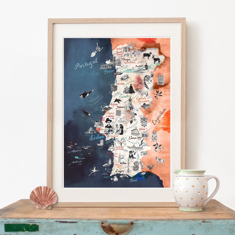 May include: A watercolor map of Portugal and Spain with hand-drawn illustrations of landmarks and cities. The map is framed in a light wood frame and has a blue and orange watercolor background.