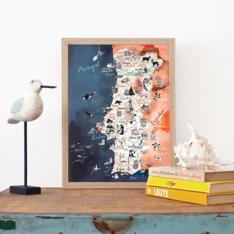May include: A watercolor map of Portugal with hand-drawn illustrations of landmarks and cities. The map is divided into two sections, one for Portugal and one for Spain. The map is framed in a light wood frame.