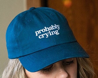 probably crying navy baseball cap, embroidered dad hat