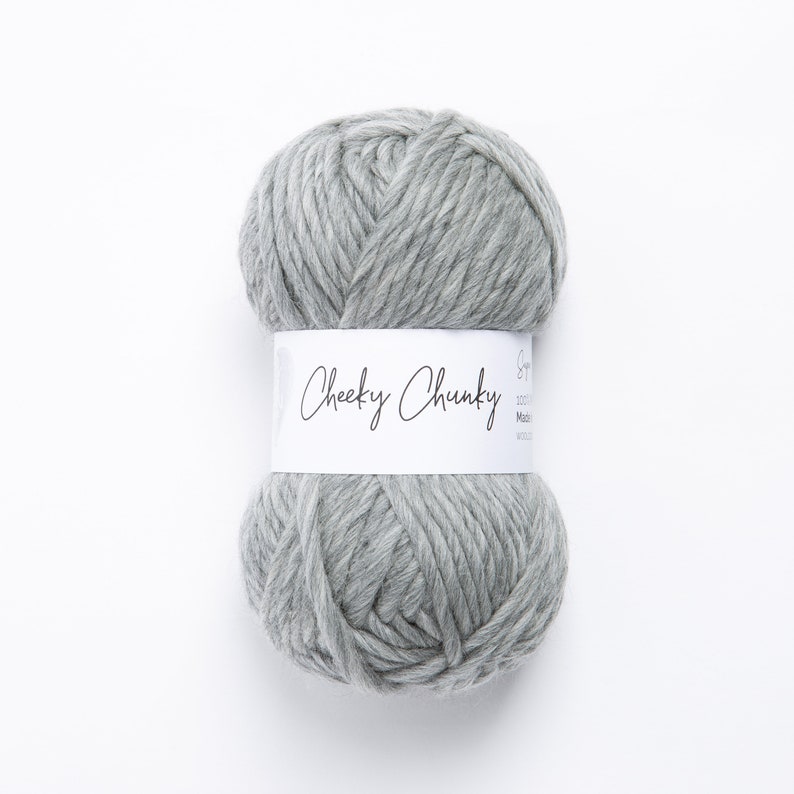 May include: A ball of gray yarn labeled "Cheeky Chunky" on a white background.