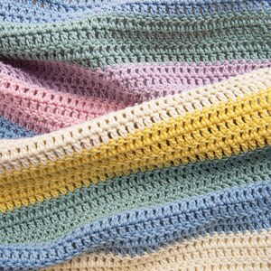 May include: A crocheted blanket featuring horizontal stripes in soft pastel colors including light blue, sage green, lavender, pale pink, cream, and sunny yellow. The fabric displays a consistent double crochet stitch pattern with a textured finish.