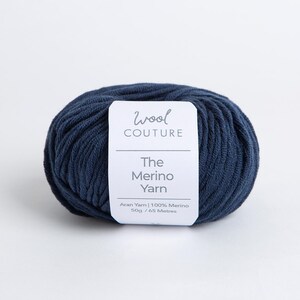May include: A ball of dark blue yarn labelled "Wool Couture The Merino Yarn Aran Yarn | 100% Merino 50g / 65 Metres"