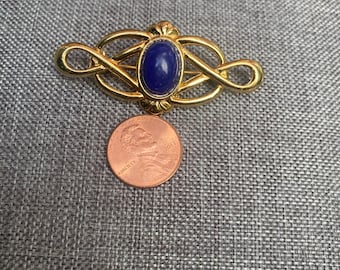 Gold tone blue Brooch