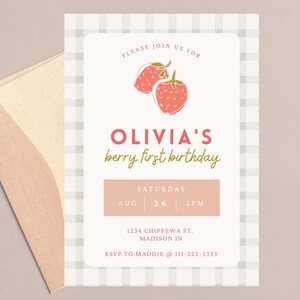 May include: A light pink invitation with a strawberry illustration and the text "OLIVIA'S berry first birthday". The invitation includes the date, time, and location. An envelope is visible in the image.