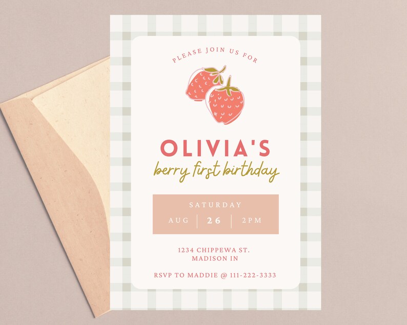 May include: A light pink invitation with a strawberry illustration and the text "OLIVIA'S berry first birthday". The invitation includes the date, time, and location. An envelope is visible in the image.