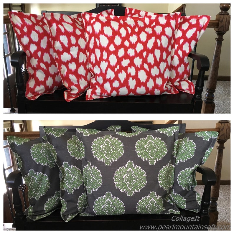May include: Two sets of decorative throw pillows. The first set is red with white abstract patterns. The second set is gray with green floral patterns.