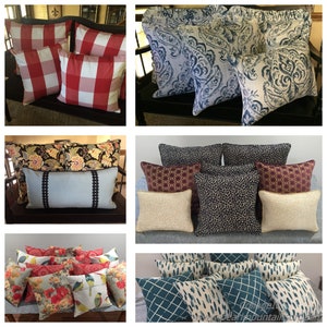 May include: Assortment of decorative throw pillows in various patterns and colors, including red and white gingham, blue and white paisley, black and white animal print, and floral designs. The pillows are arranged on a variety of surfaces, including a wooden bench, a couch, and a bed.