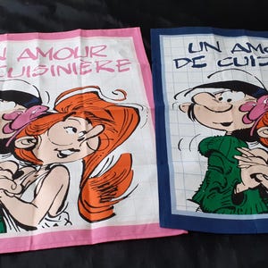 Two French cotton printed Gaston and Jeanne cartoon tea towels / torchons  (17537) Q