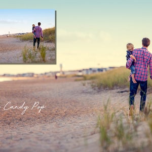 May include: A father and son walk along a sandy beach with tall grass on either side. The father is wearing a red and black plaid shirt, blue jeans, and brown sandals. The son is wearing a blue shirt and blue shorts. The text "Cotton Candy Pop" is written in white on the sand.