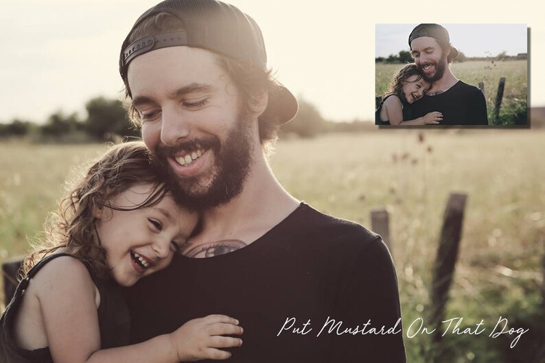 May include: A father and daughter are smiling and hugging in a field. The father is wearing a black baseball cap and a black shirt. The daughter is wearing a black tank top. The text "Put Mustard On That Dog" is written in white cursive on the bottom of the image.