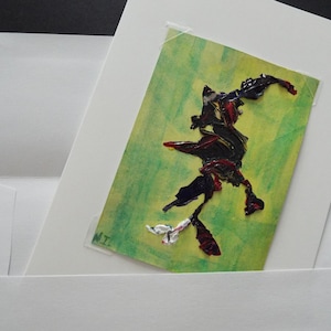 May include: A colorful abstract painting with a green background and a black, red, and white figure. The figure is made of thick paint and appears to be dancing.